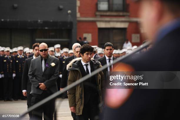 Family members of New York City fire department EMT Yadira Arroyo walk into St. Nicholas of Tolentine R.C. Church in the Bronx for her funeral on...