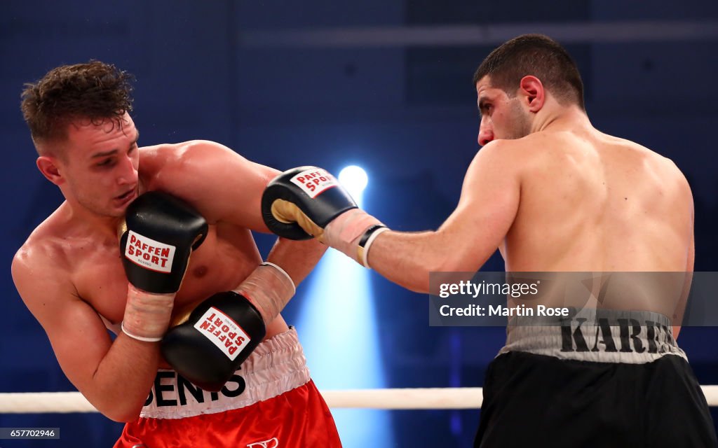 Rodavan Denis Rodavan of Germany and Atin Karabet of Germany exchange punches ...