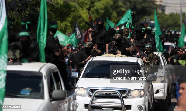 Members of the Ezzedine al-Qassam Brigades, the military wing of the Palestinian Islamist movement Hamas take part in the funeral of Hamas official,...