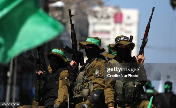 Members of the Ezzedine al-Qassam Brigades, the military wing of the Palestinian Islamist movement Hamas take part in the funeral of Hamas official,...