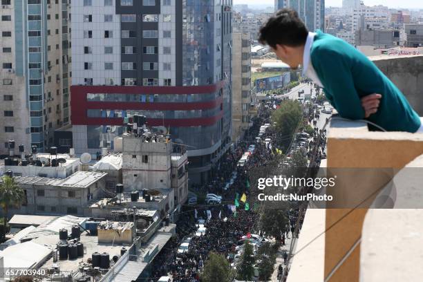 Members of the Ezzedine al-Qassam Brigades, the military wing of the Palestinian Islamist movement Hamas carry the body of Hamas official, Mazen...