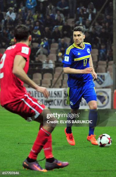 Bosnia and Herzegovina's Ervin Zukanovic vies with Gibraltar's Jean-Carlos Garcia during the FIFA World Cup 2018 qualification football match between...