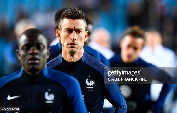 France's defender Laurent Koscielny warms up prior to the FIFA World Cup 2018 qualifying football match between Luxembourg and France on March 25 at...
