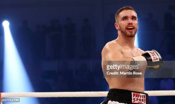 Leon Bunn of Germany celebrates after he knocks down Viktor Kessler of Russia during their light heavyweight fight at MBS Arena on March 25, 2017 in...