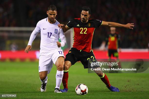 Panagiotis Tachtsidis of Greece battles for the ball with Nacer Chadli of Belgium during the FIFA 2018 World Cup Group H Qualifier match between...