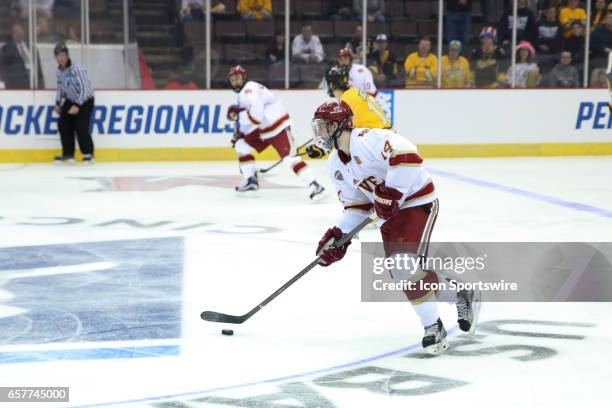 Denver Pioneers forward Colin Staub controls the puck during the Midwest Regional of the NCAA Hockey Championship between the Denver Pioneers and the...