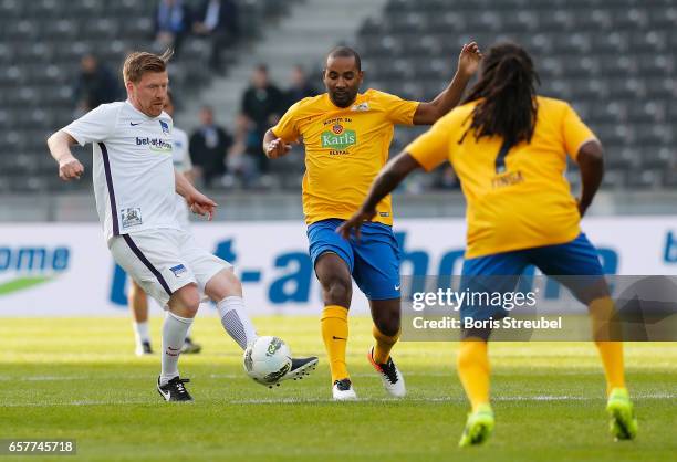 Zecke Neuedorf is challenged by Cacau during the Marcelinho testimonial match between a team of former Hertha BSC players and a team of brasilian...