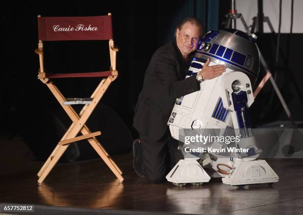 Todd Fisher and R2-D2 speaks at Debbie Reynolds and Carrie Fisher Memorial at Forest Lawn Cemetery on March 25, 2017 in Los Angeles, California.