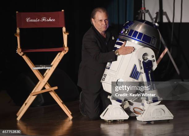 Todd Fisher and R2-D2 speaks at Debbie Reynolds and Carrie Fisher Memorial at Forest Lawn Cemetery on March 25, 2017 in Los Angeles, California.