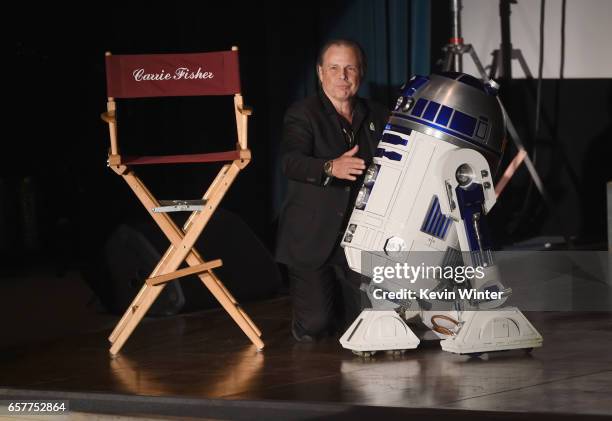 Todd Fisher and R2-D2 speaks at Debbie Reynolds and Carrie Fisher Memorial at Forest Lawn Cemetery on March 25, 2017 in Los Angeles, California.