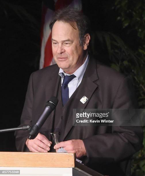 Actor Dan Aykroyd speaks onstage at Debbie Reynolds and Carrie Fisher Memorial at Forest Lawn Cemetery on March 25, 2017 in Los Angeles, California.