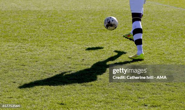 Shadow of a player kicking the ball during the Sky Bet League Two match between Wycombe Wanderers and Notts County at Adams Park on March 25, 2017 in...