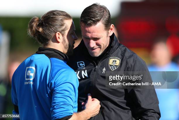 Alan Smith of Notts County talks to Kevin Nolan of manager Notts County during the Sky Bet League Two match between Wycombe Wanderers and Notts...