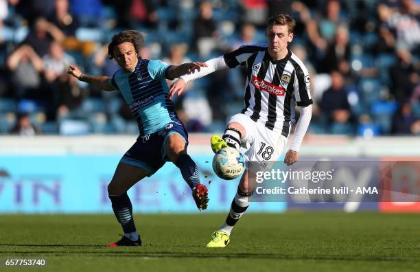 Sam Saunders of Wycombe Wanderers and Elliott Hewitt of Notts County during the Sky Bet League Two match between Wycombe Wanderers and Notts County...