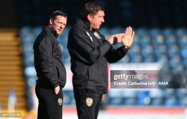 Kevin Nolan of manager Notts County watches assistant Richard Thomas during the Sky Bet League Two match between Wycombe Wanderers and Notts County...