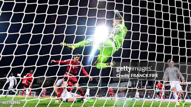 France's forward Olivier Giroud scores a goal in front of Luxembourg's goalkeper Ralph Schon during the FIFA World Cup 2018 qualifying football match...
