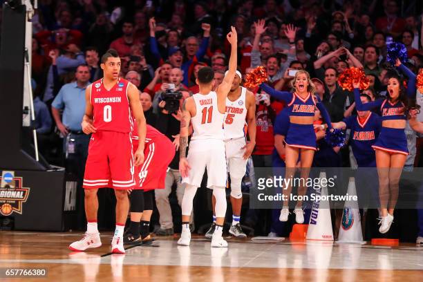 Florida Gators guard Chris Chiozza celebrates after making the game winning three point shot during overtime of the 2017 NCAA Men's Basketball...