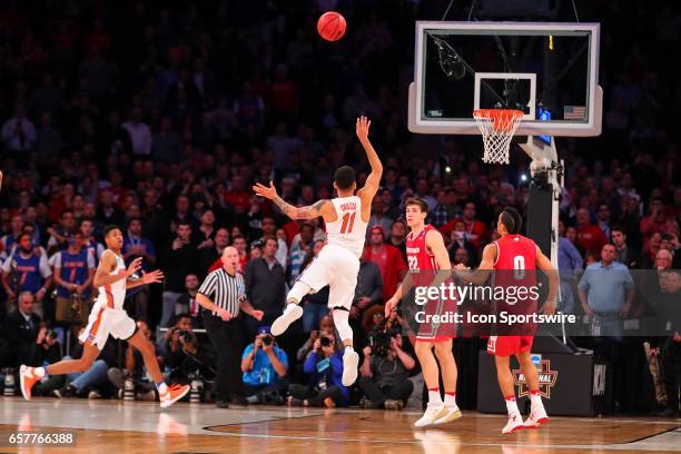 Florida Gators guard Chris Chiozza shoots the game winning three point shot during overtime of the 2017 NCAA Men's Basketball Tournament East...