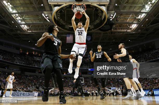 Zach Collins of the Gonzaga Bulldogs dunks against the Xavier Musketeers in the first half during the 2017 NCAA Men's Basketball Tournament West...