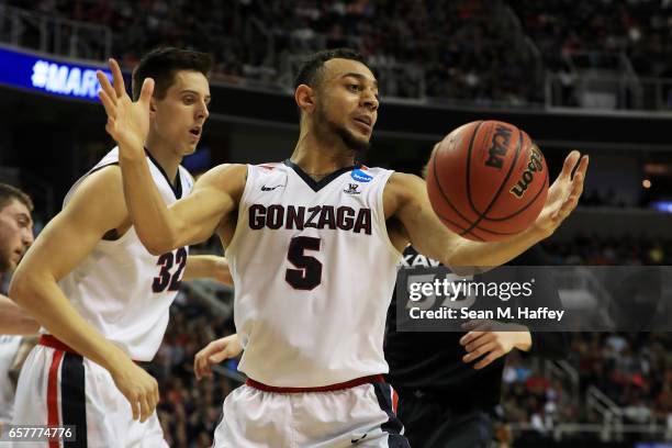 Nigel Williams-Goss of the Gonzaga Bulldogs rebounds against J.P. Macura of the Xavier Musketeers in the first half during the 2017 NCAA Men's...