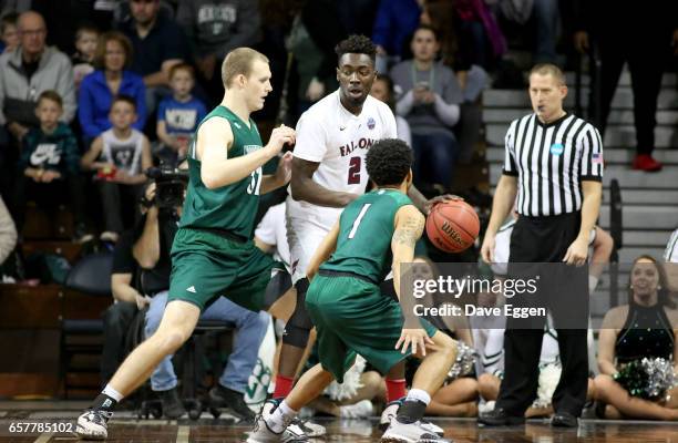 Matt Bingaya of Fairmont State University gets pressure from Brett Dougherty and Justin Pitts of Northwest Missouri State University during the...