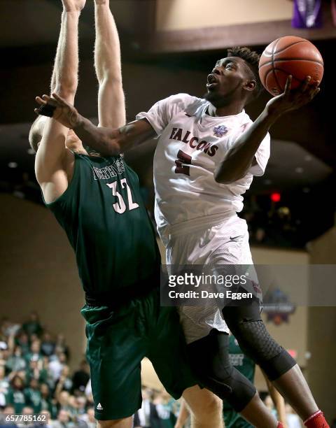 Matt Bingaya from Fairmont State University takes the ball to the basket against Brett Dougherty from Northwest Missouri State University during the...