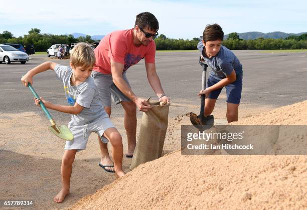 Townsville residents fill sandbags in preparation for Cyclone Debbie on March 26, 2017 in Townsville, Australia. Cyclone Debbie has intensified to a...