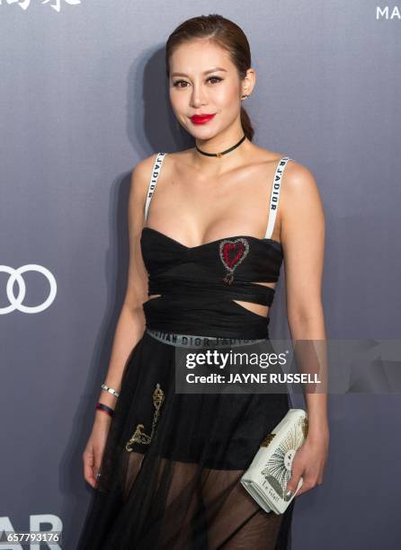 Elly Lam, daughter of Peter Lam and Lynn Hsieh, poses on the red carpet during the 2017 American Foundation for AIDS Research Hong Kong gala at Shaw...