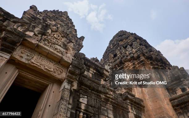 exterior of stone castle from low angle view - phimai foto e immagini stock