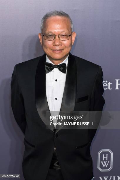 Marcellus Wong, Vice Chairman of the Board of Directors of the AMTD, group poses on the red carpet during the 2017 American Foundation for AIDS...