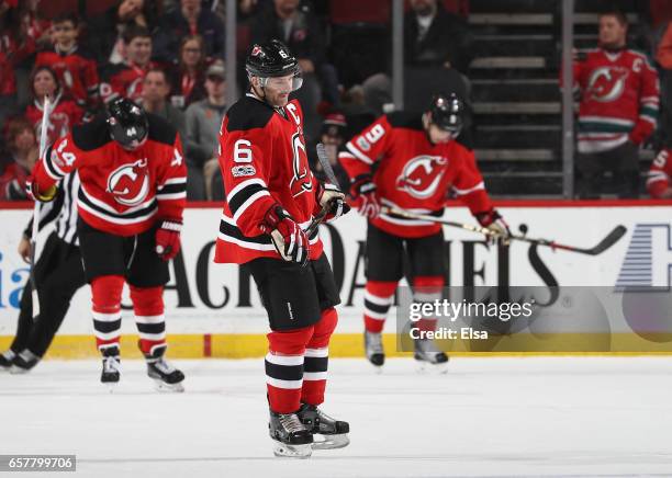 Andy Greene of the New Jersey Devils and the rest of his teamamtes react to the loss to the Carolina Hurricanes on March 25, 2017 at Prudential...