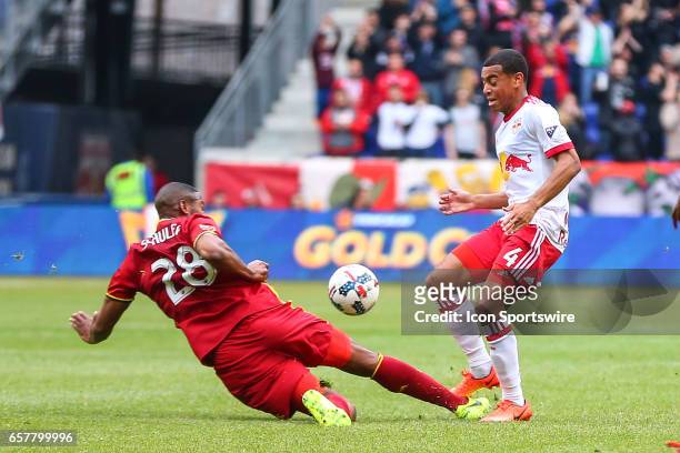 New York Red Bulls midfielder Tyler Adams passes the ball past Real Salt Lake defender Chris Schuler during the first half of the MLS Soccer game...