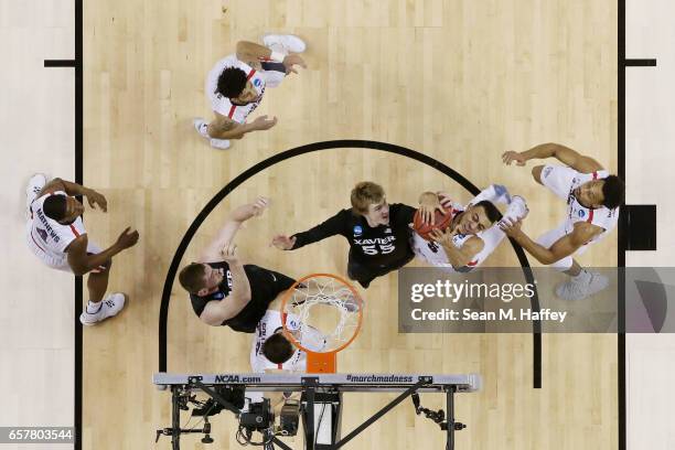 Nigel Williams-Goss of the Gonzaga Bulldogs goes up against J.P. Macura of the Xavier Musketeers during the 2017 NCAA Men's Basketball Tournament...