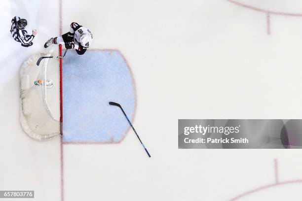 Jamie McGinn of the Arizona Coyotes breaks his stick over the crossbar after Daniel Winnik of the Washington Capitals , scored an empty net goal...