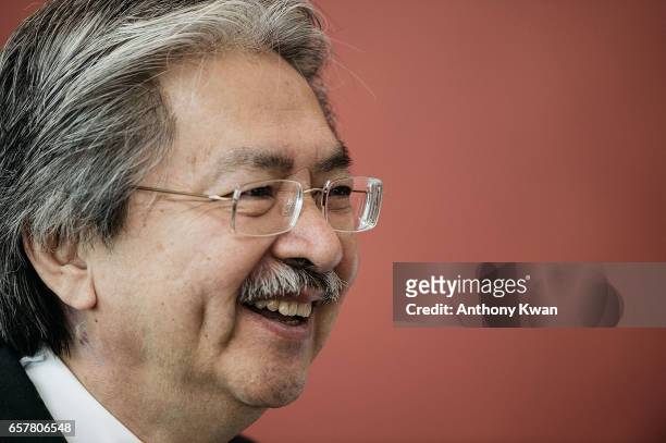 Candidate for Hong Kong's chief executive and Hong Kong's former financial secretary John Tsang, stands outside of a polling station for the chief...