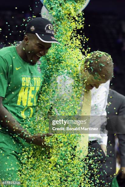 Head coach Dana Altman of the Oregon Ducks is dunked with confetti after defeating the Kansas Jayhawks 74-60 during the 2017 NCAA Men's Basketball...