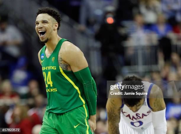 Dillon Brooks of the Oregon Ducks and Frank Mason III of the Kansas Jayhawks react in the second half during the 2017 NCAA Men's Basketball...