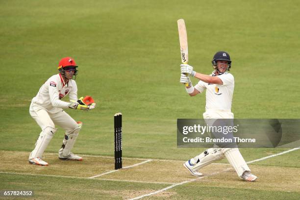 Marcus Harris of the Bushrangers hits for six during the Sheffield Shield final between Victoria and South Australia on March 26, 2017 in Alice...