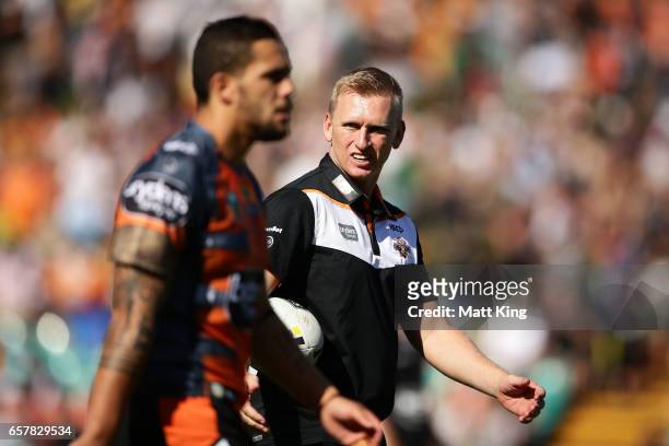 Tigers interim coach Andrew Webster takes part in warm up before the round four NRL match between the Wests Tigers and the Melbourne Storm at...