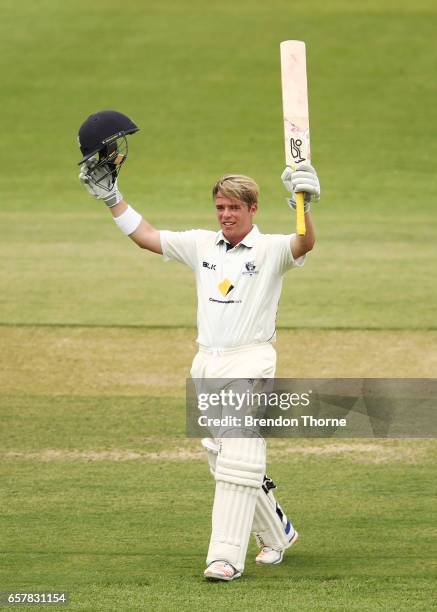 Marcus Harris of the Bushrangers celebrates scoring his century during the Sheffield Shield final between Victoria and South Australia on March 26,...