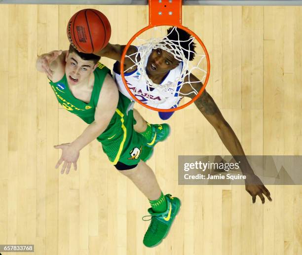 Payton Pritchard of the Oregon Ducks shoots the ball against Lagerald Vick of the Kansas Jayhawks in the first half during the 2017 NCAA Men's...