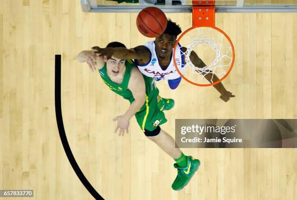 Payton Pritchard of the Oregon Ducks shoots the ball against Lagerald Vick of the Kansas Jayhawks in the first half during the 2017 NCAA Men's...