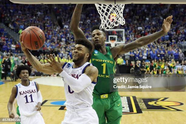 Frank Mason III of the Kansas Jayhawks drives to the basket against Jordan Bell of the Oregon Ducks in the second half during the 2017 NCAA Men's...