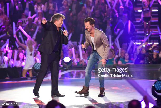Austrian singer Andy Borg and german moderator Florian Silbereisen during the show 'Schlagercountdown - Das grosse Premierenfest' at EWE Arena on...