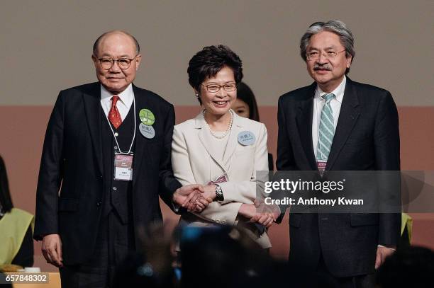 Carrie Lam, Hong Kong's chief executive-elect, center, stands on stage with candidates for Hong Kong's chief executive John Tsang, Hong Kong's former...