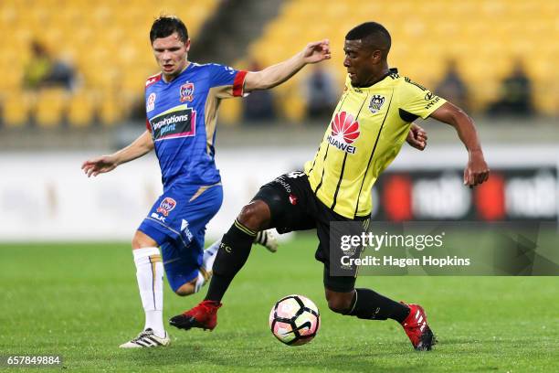 Roly Bonevacia of the Phoenix avoids the defense of Wayne Brown of the Jets during the round 24 A-League match between Wellington Phoenix and...