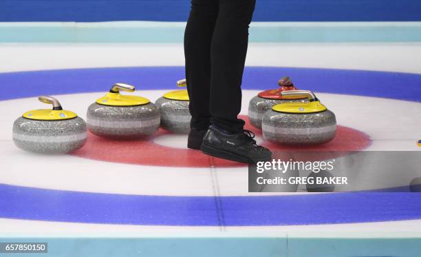 Swedish player looks over stones during the bronze medal match against Scotland at the Women's Curling World Championships in Beijing on March 26,...