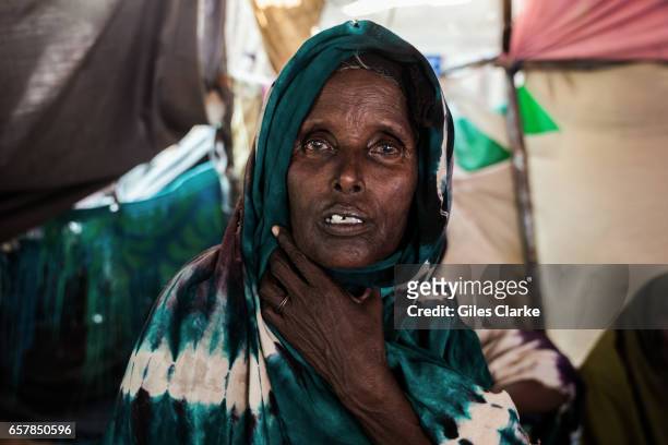 March 6, 2017: An elderly Internally Displaced Woman sits in a tent in a camp in central Mogadishu. Somalia is in the grip of an intense drought,...