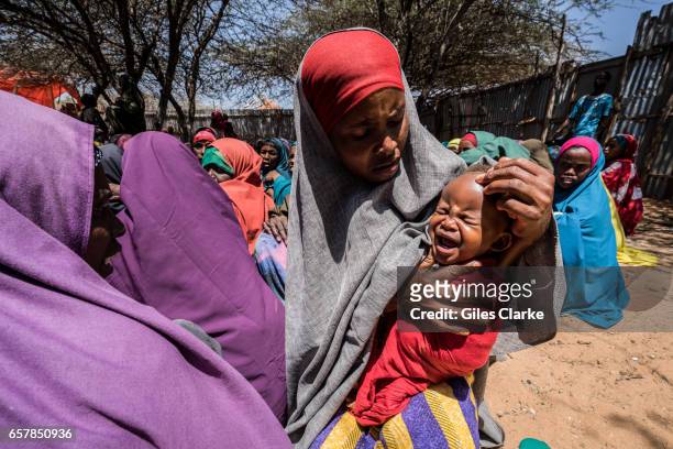 March 7, 2017: A young mother and baby in a World Food Program food center in central Mogadishu. Somalia is in the grip of an intense drought,...