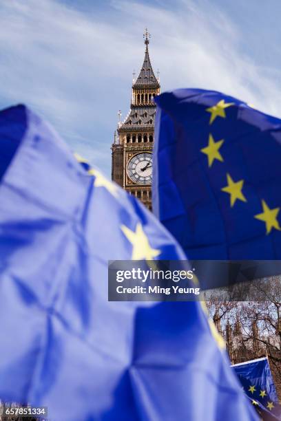 European flags being flown in front of Big Ben in Parliament Square during the 'Unite For Europe' march on March 25, 2017 in London, England....